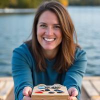 Enthusiastic angler proudly displaying a collection of handmade custom lures.
